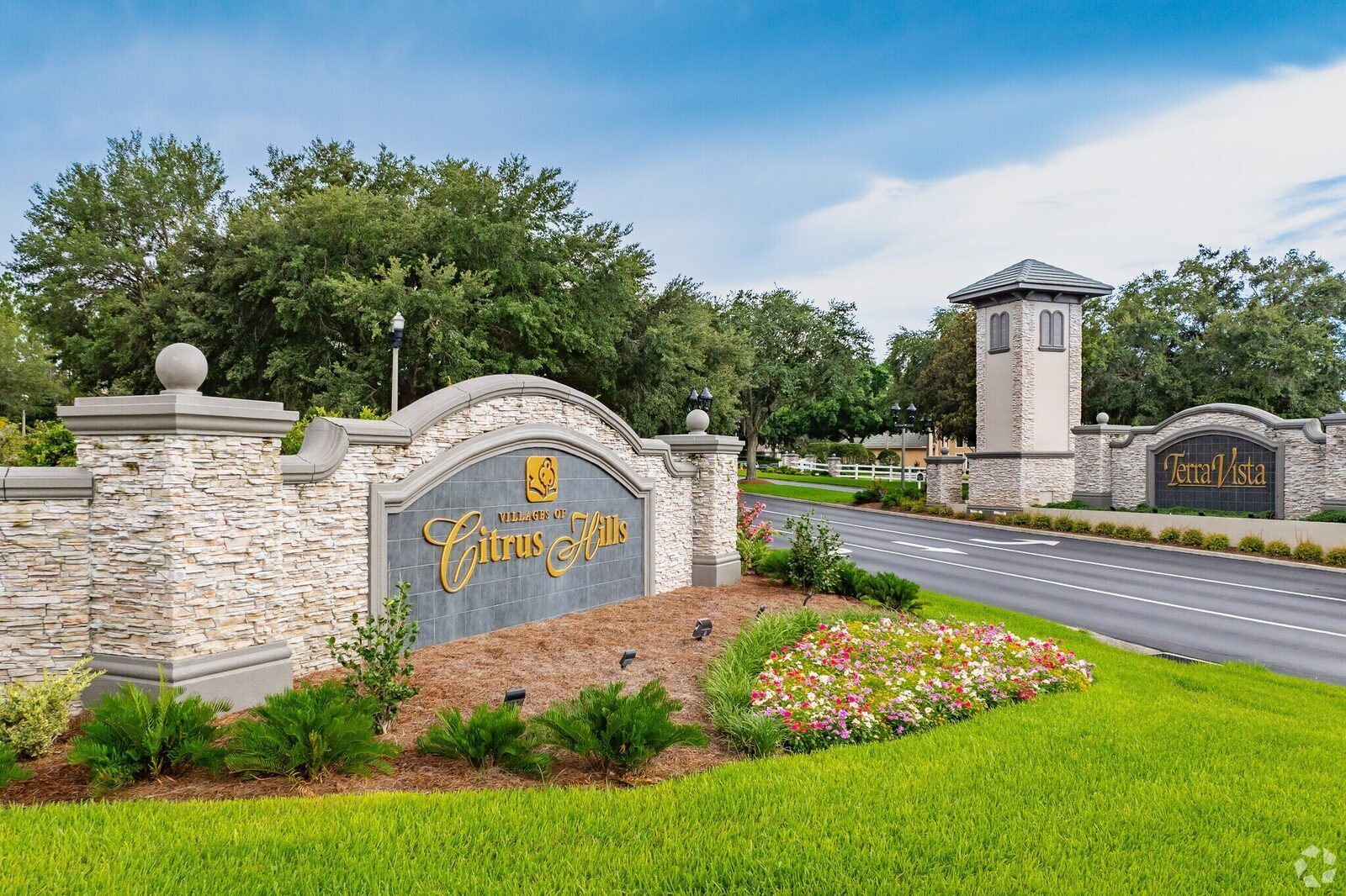 Stone monument signs marking the Villages of Citrus Hills and Terra Vista community entry.