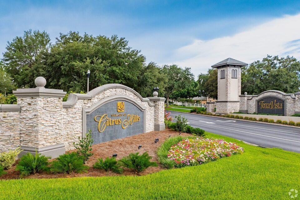 Stone monument signs marking the Villages of Citrus Hills and Terra Vista community entry.
