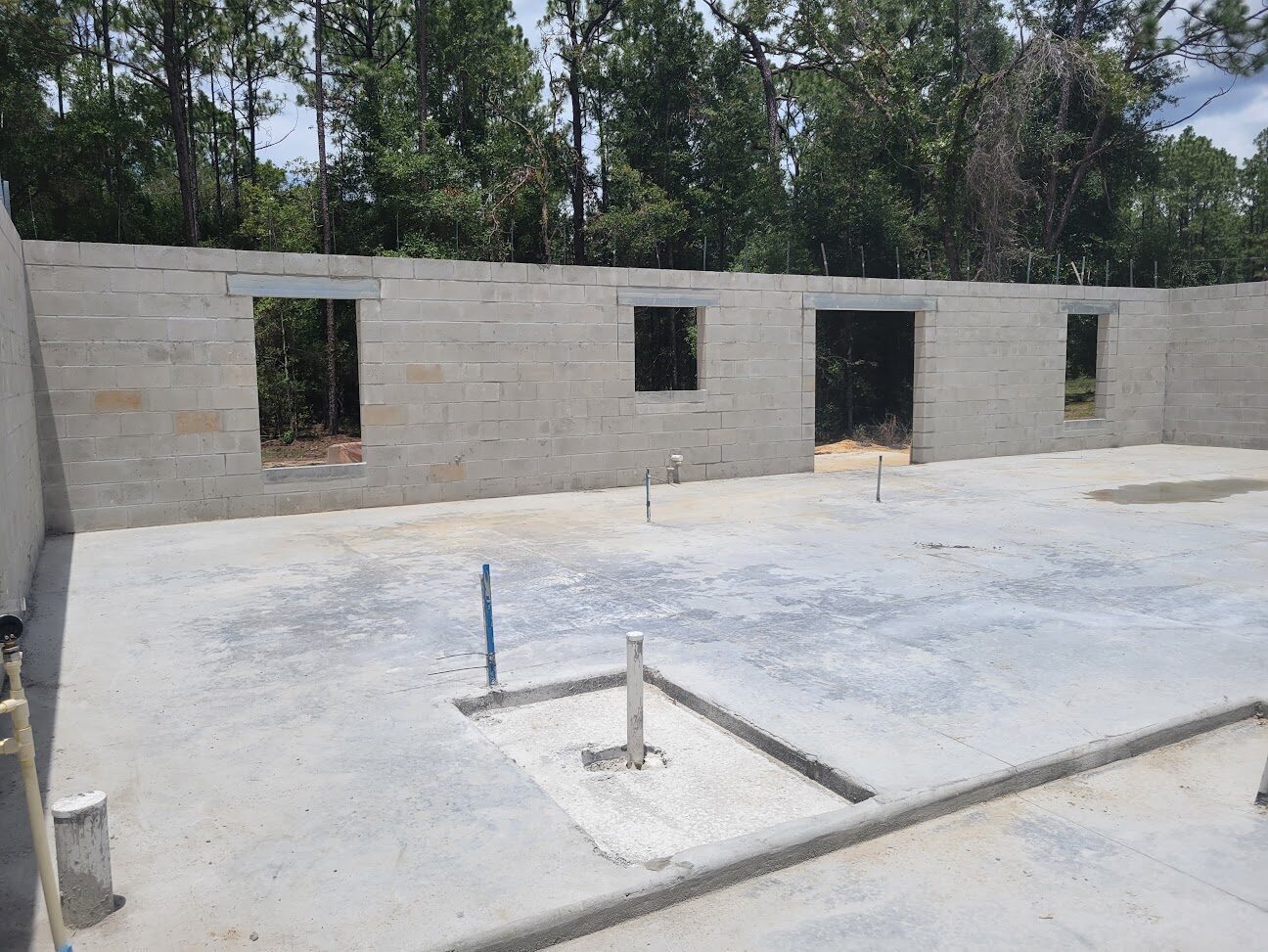 Concrete-block walls and slab foundation of a new home under construction in Citrus Springs.