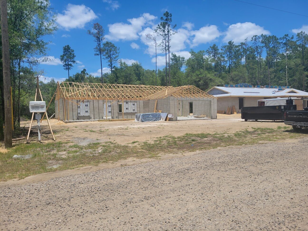 New home framing being raised on a Citrus Springs build site.