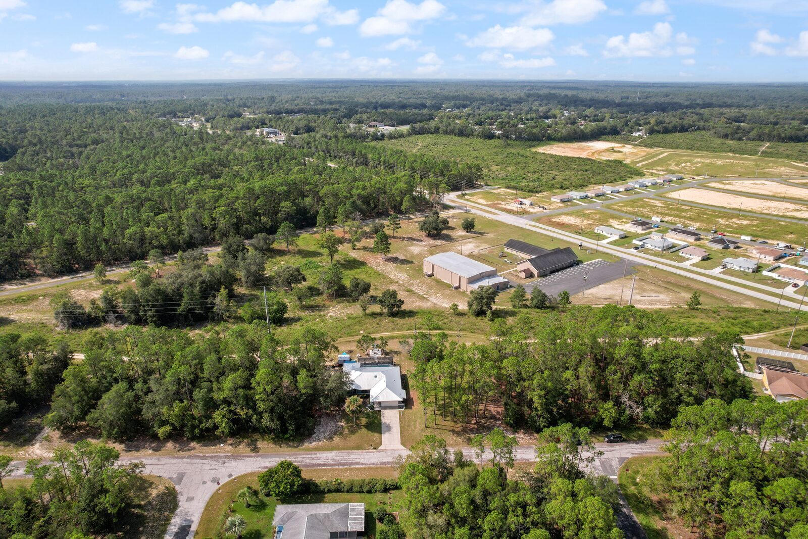 Drone view of Citrus Springs showing existing homes, vacant lots, and new construction in progress.